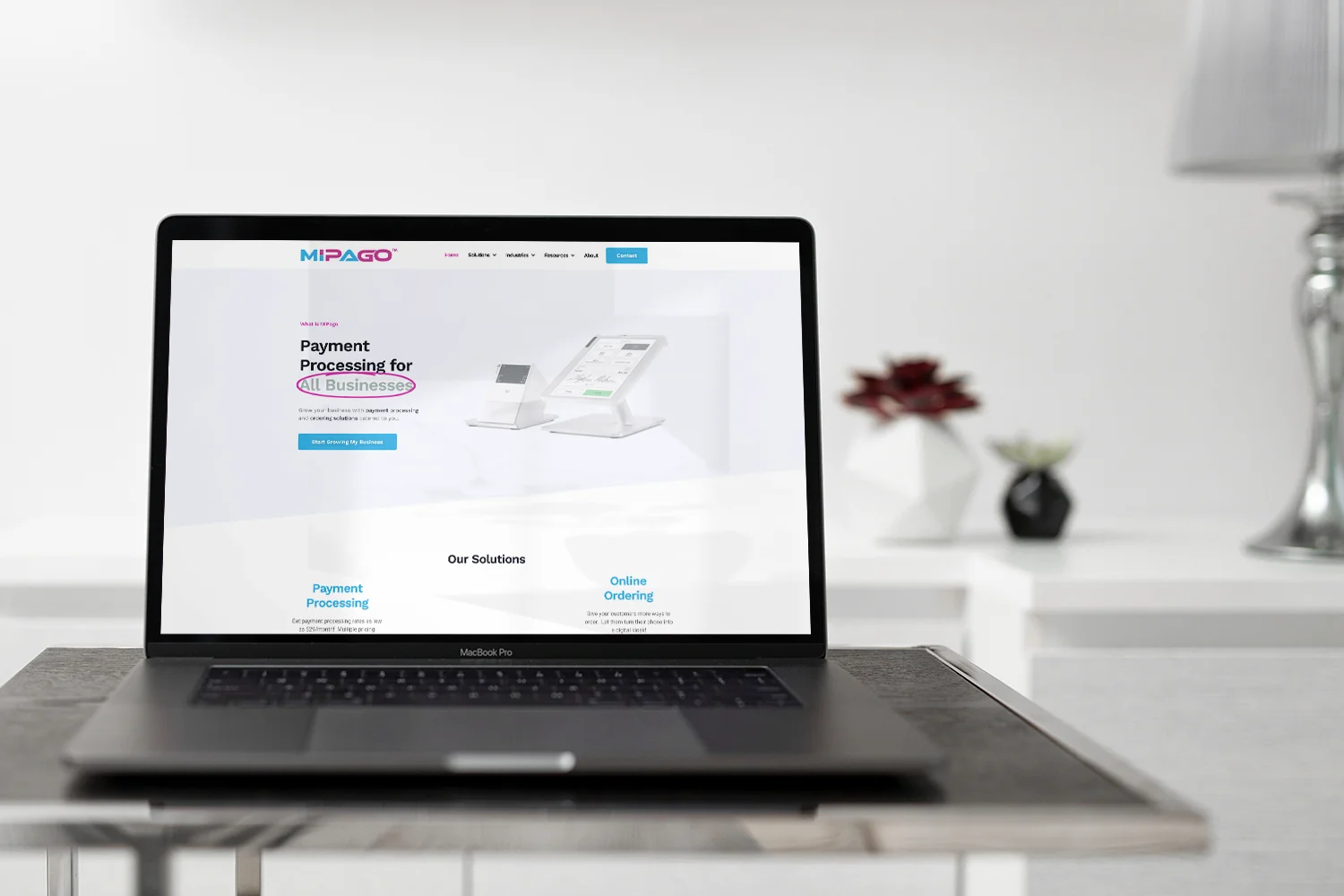 MiPago website shown on a Macbook